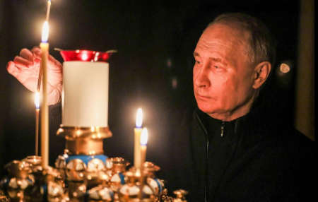 عکسهای جالب,عکسهای جذاب,برافروختن شمع از سوی ولادیمیر پوتین به یاد قربانیان حمله تروریستی اخیر به مسکو