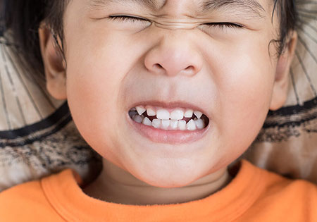 علت دندان قروچه کودک در خواب چیست,علت دندان قروچه در کودکان